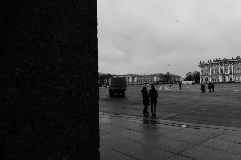 a black and white photo of people walking in the rain, a black and white photo, inspired by Henri Cartier-Bresson, unsplash, realism, on a great neoclassical square, 000 — википедия, military camp in the background, van