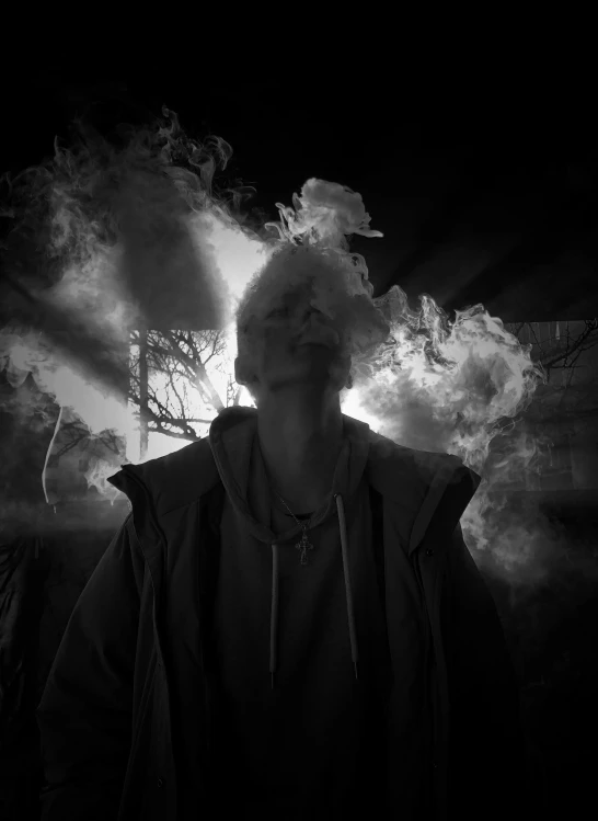 a man standing in the dark with smoke coming out of his mouth, a black and white photo, pexels contest winner, conceptual art, the suns light is consumed, taken on iphone 14 pro, yung lean, a portrait of @hypnos_onc