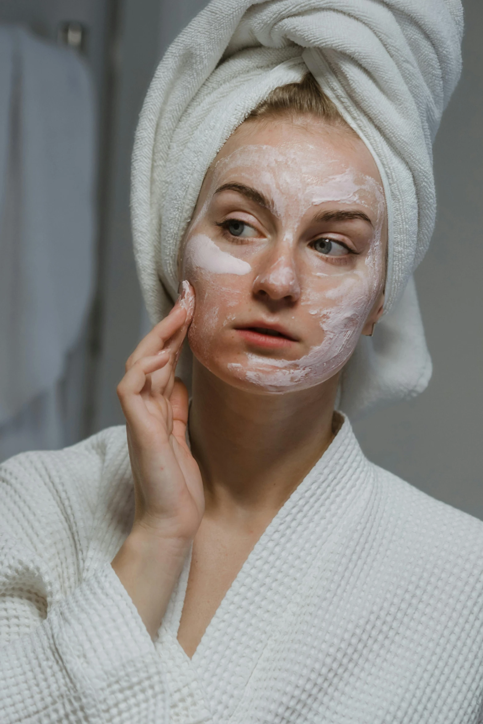 a woman with a towel wrapped around her head, by Adam Marczyński, trending on pexels, renaissance, a plaster on her cheek, multi-part, white, college