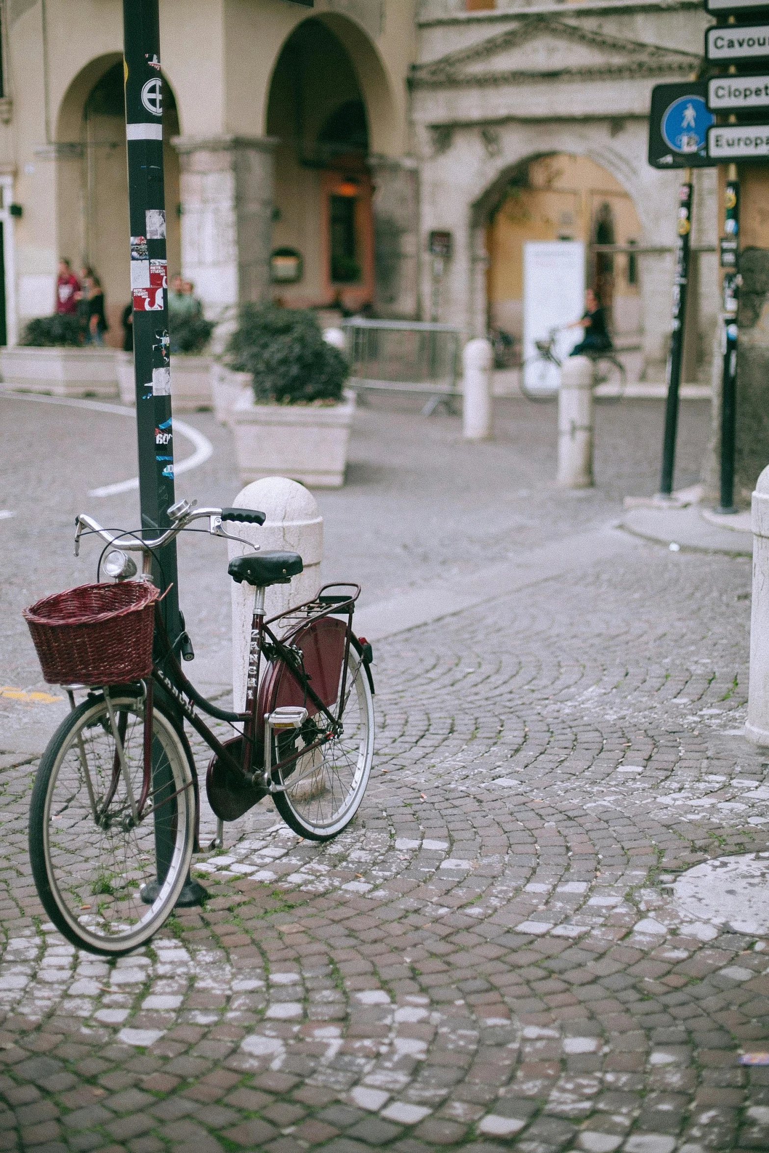 a bicycle parked on the side of a street, pexels contest winner, mozzarella everywhere, square, maroon, vintage photo