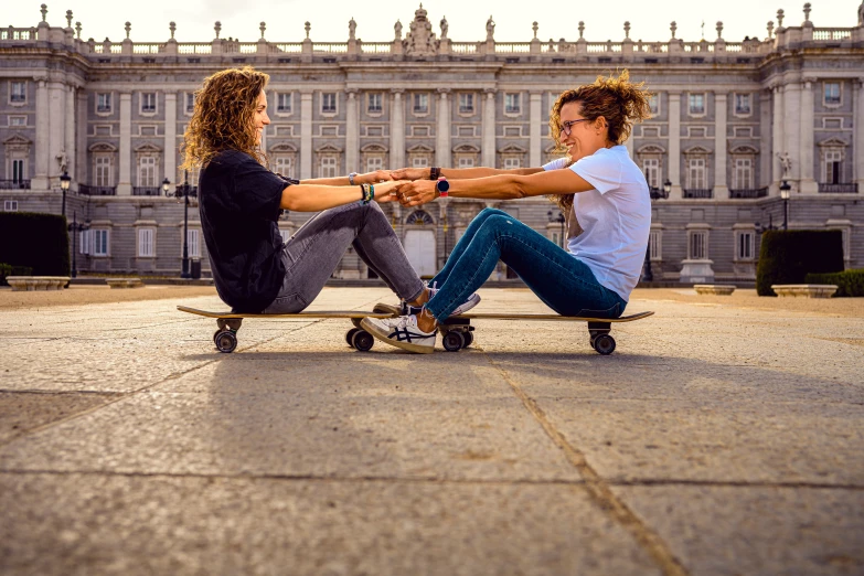 a couple of people sitting on top of a skateboard, by Julia Pishtar, pexels contest winner, renaissance, royal palace, lesbian, fransico goya, extreme foreshortening