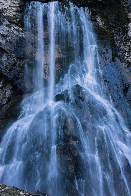 a waterfall in the middle of a rocky area, an album cover, by Leonard Bahr, unsplash, renaissance, 2 5 6 x 2 5 6 pixels, blue, chile, close up of iwakura lain