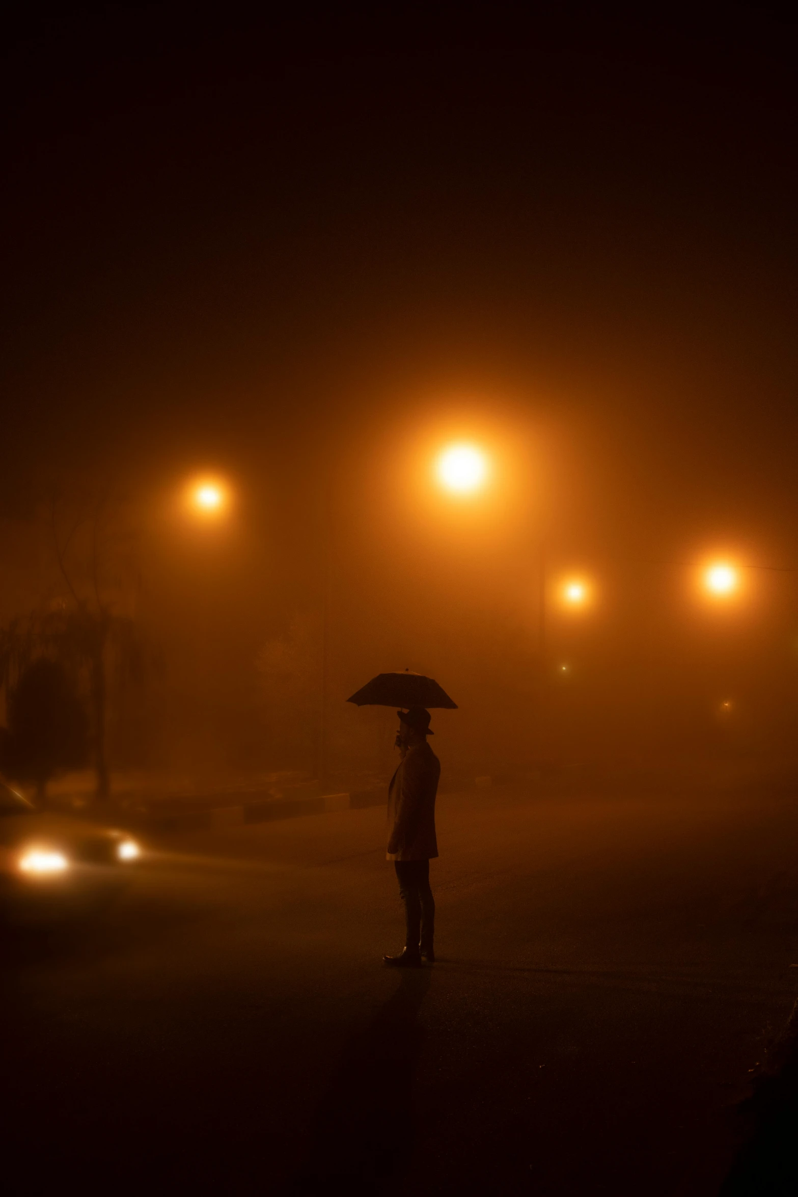 a person standing on a street at night with an umbrella, orange fog, ap news photograph, contemplating, ilustration