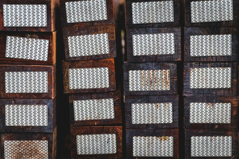 a bunch of wooden crates stacked on top of each other, an album cover, unsplash, visual art, perforated metal, woodfired, snakeskin, surface hives