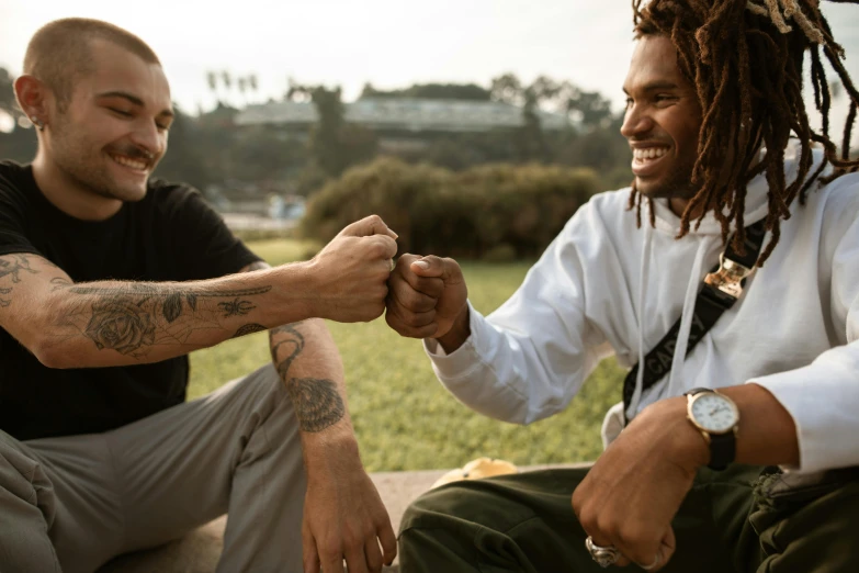 a couple of men sitting next to each other, pexels contest winner, dreads, fistfighting, avatar image, happy friend