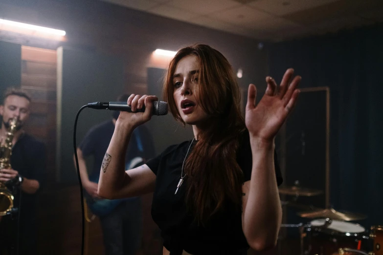 a woman that is standing in front of a microphone, an album cover, pexels contest winner, antipodeans, performing a music video, rosalia, shallow d. o. f, epk