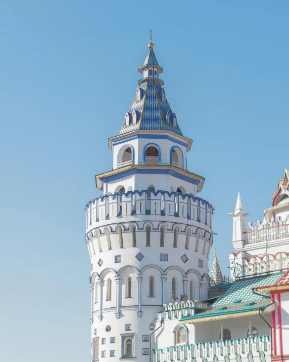 a large white castle sitting on top of a lush green field, inspired by Vasily Surikov, unsplash contest winner, art nouveau, red - yellow - blue building, street of moscow, elevation view, 000 — википедия