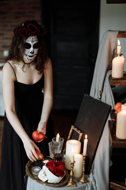a woman in day of the dead makeup holding an apple, inspired by Pietro Longhi, pexels contest winner, gothic art, on the altar, a seance, tall, haunted house interior