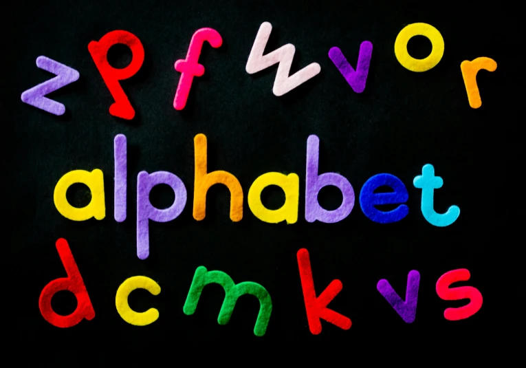 a close up of the letters of the alphabet, unsplash, blackboard, brightly coloured, slide show, alpha