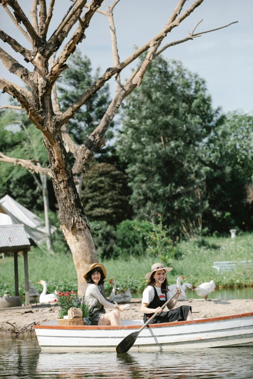 two people in a boat on a body of water, sitting in the garden, kuntilanak on tree, wearing a straw hat and overalls, dreamworld