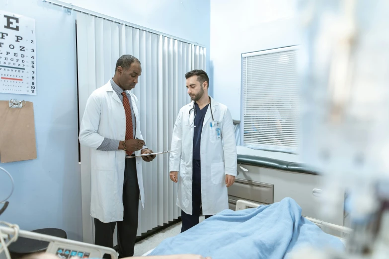 a couple of men standing next to a hospital bed, pexels, renaissance, inspect in inventory image, (doctor), riyahd cassiem, two male