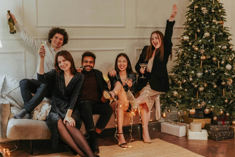 a group of people sitting on a couch in front of a christmas tree, by Emma Andijewska, pexels contest winner, renaissance, sassy pose, charcoal and champagne, avatar image, profile picture