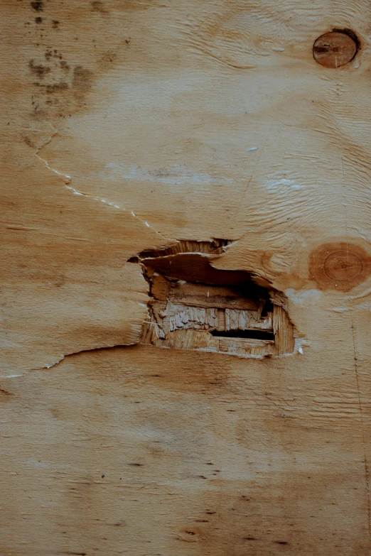 a piece of wood with a hole in it, inspired by Antoni Tàpies, trending on pexels, recessed, brown, square, under repairs