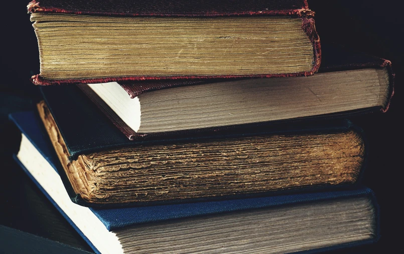 a stack of books sitting on top of each other, an album cover, unsplash, renaissance, vintage colours, 1900s photo, thumbnail, multiple stories