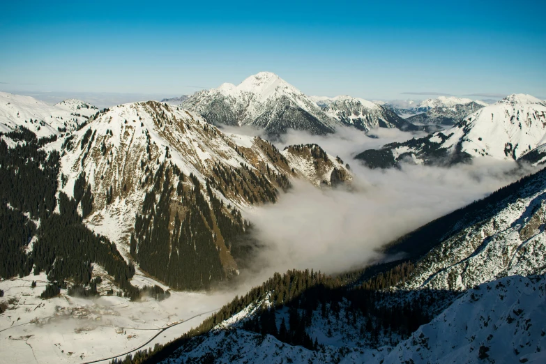 a view of snow covered mountains from the top of a mountain, by Peter Churcher, pexels contest winner, baroque, avatar image, multiple stories, conde nast traveler photo, gigapixel photo