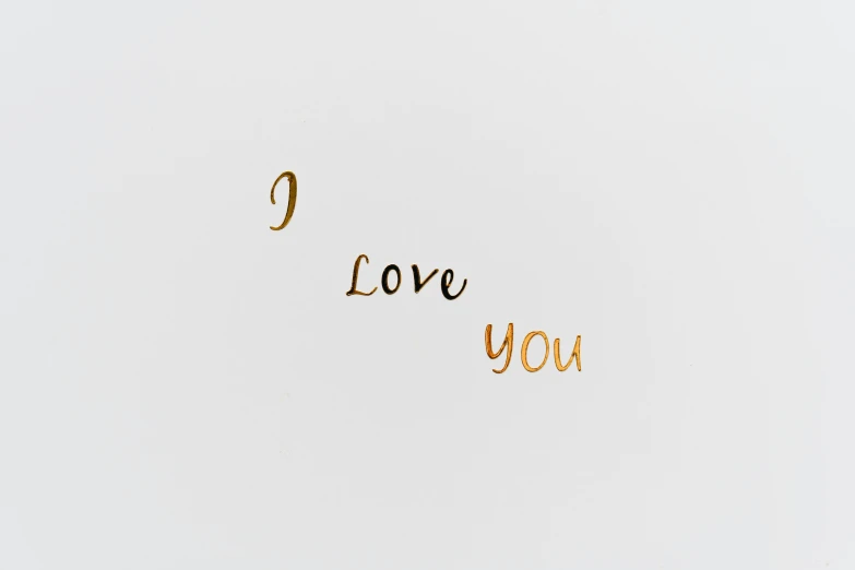 a card with the words i love you written on it, inspired by Anna Füssli, unsplash, ffffound, glossy white metal, 1 2 9 7, golden inlays