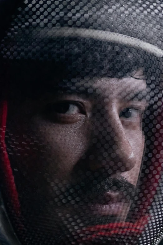 a close up of a person wearing a helmet, a picture, inspired by Yasutomo Oka, reddit, adam driver behind, arrival ( film ), person made out of glass, wearing space techwear