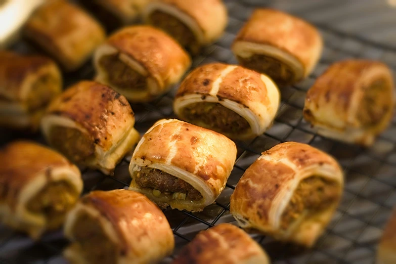 a bunch of food that is on a rack, scrolls, looking towards the camera, square, puffy