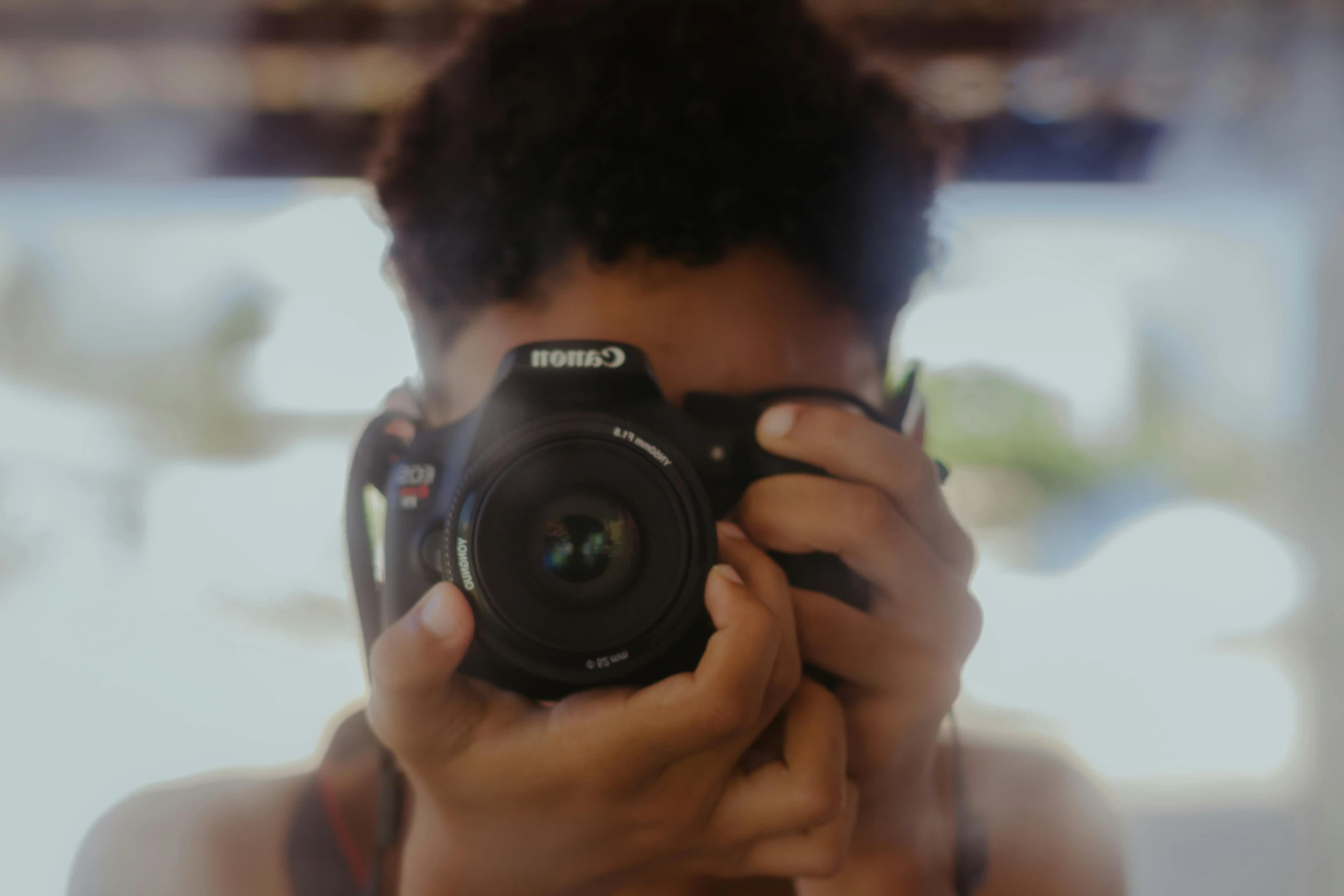 a person taking a picture with a camera, black teenage boy, portrait featured on unsplash, avatar image, full frame image