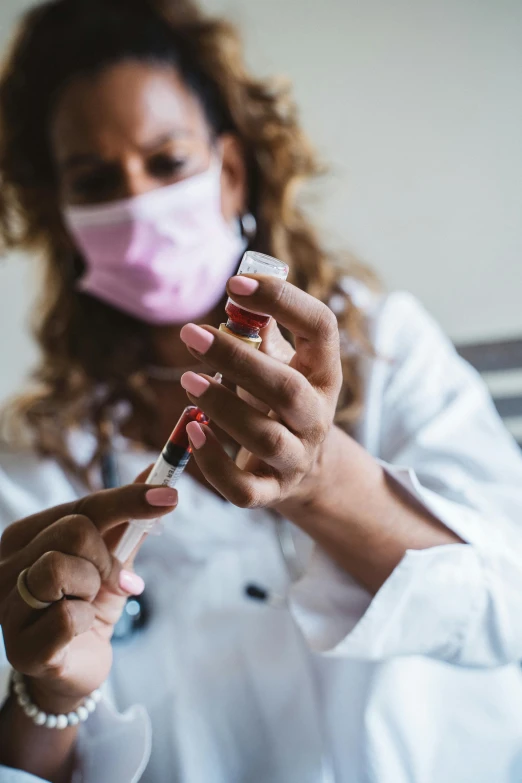 a close up of a person wearing a face mask, blood collection vials, wearing lab coat and a blouse, instagram photo, thumbnail