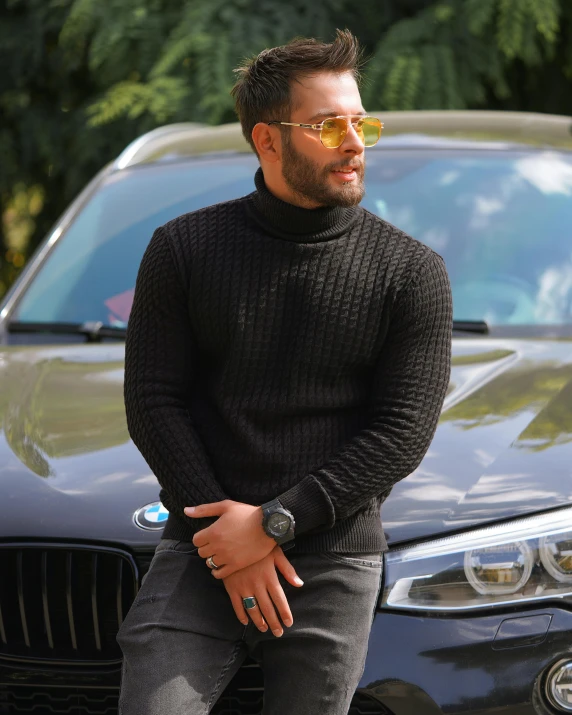 a man that is standing in front of a car, trending on instagram, black turtle neck shirt, thumbnail, genzoman, wearing sweater