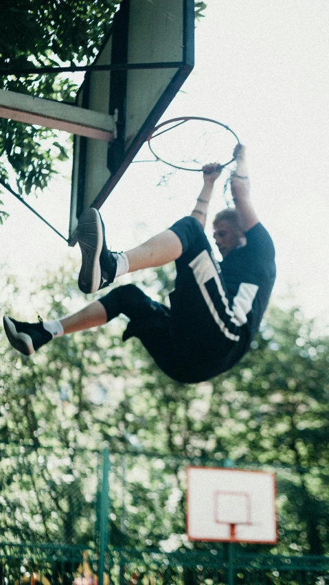 a man flying through the air while holding a tennis racquet, by Niko Henrichon, pexels contest winner, happening, hanging upside down from a tree, athletic crossfit build, sitting down, yung lean