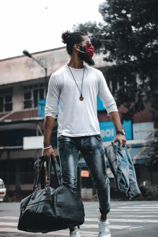 a man walking across a street carrying a bag, pexels contest winner, graffiti, mask off, white shirt and jeans, avatar image, red afro