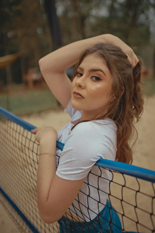 a woman sitting on top of a tennis court holding a racquet, an album cover, inspired by Elsa Bleda, pexels contest winner, volleyball net, pretty pretty face, portrait of zendaya, profile image