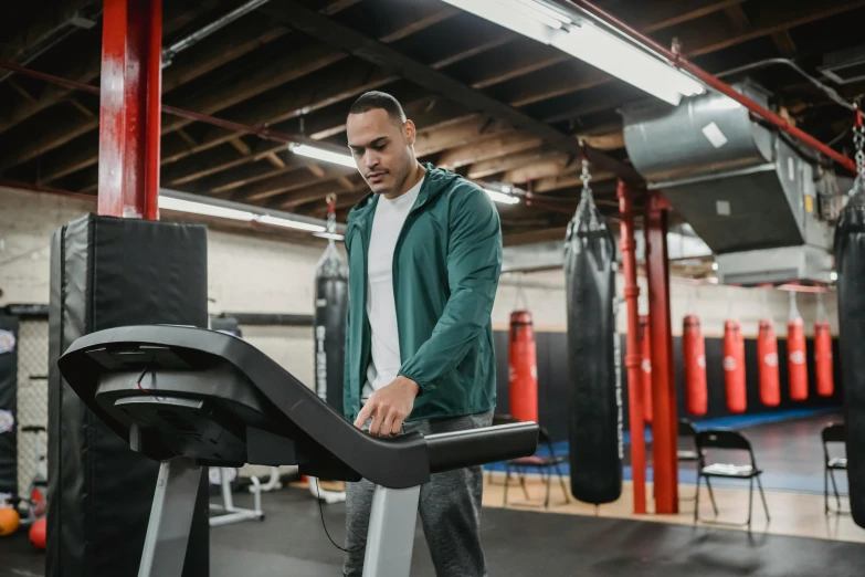 a man running on a treadmill in a gym, a portrait, pexels contest winner, fan favorite, riyahd cassiem, center focus on table, inspect in inventory image