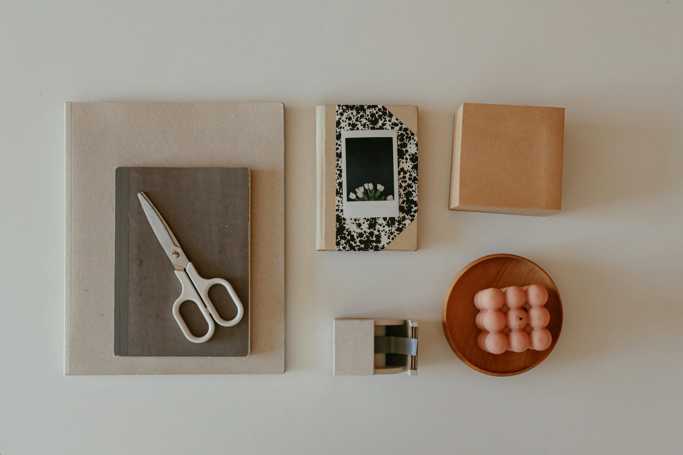 a table topped with a bowl of eggs and a pair of scissors, inspired by Sarah Lucas, unsplash, postminimalism, picture frames, flatlay book collection, square shapes, 9 0 mm studio photograph tiny