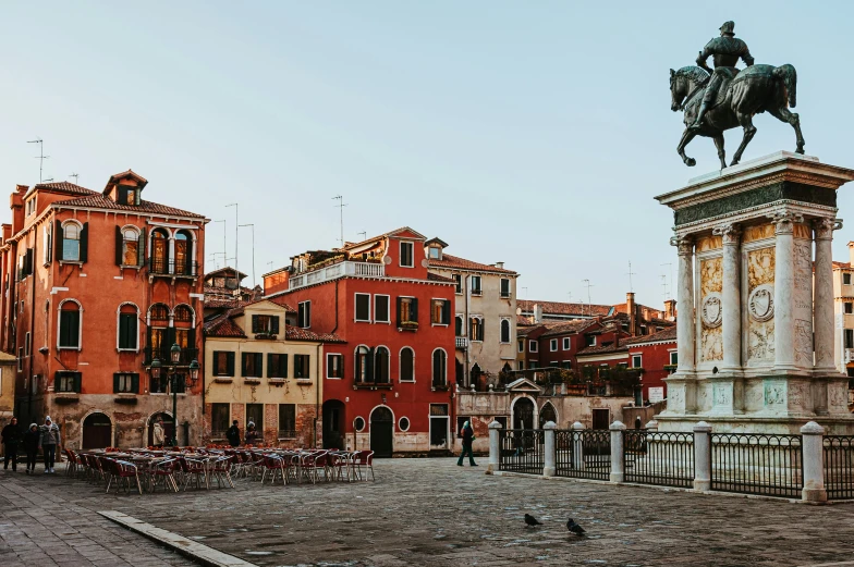 a statue of a man on a horse in a plaza, inspired by Quirizio di Giovanni da Murano, pexels contest winner, panoramic view, venice biennale, square, late afternoon