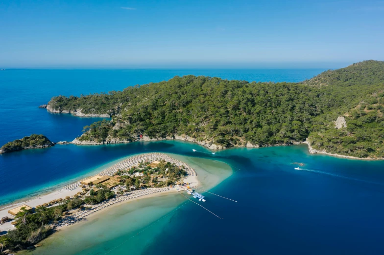 a small island in the middle of a body of water, by Julian Allen, pexels contest winner, hurufiyya, turkey, white beaches, picton blue, lush surroundings