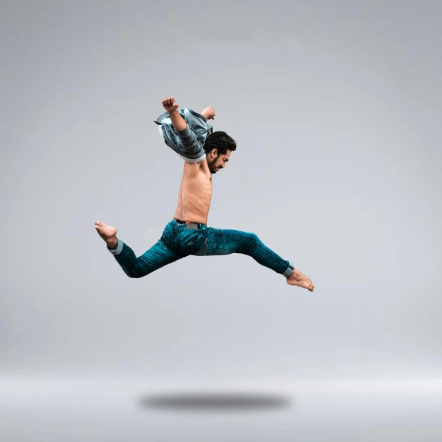 a man that is jumping in the air, pexels contest winner, arabesque, on simple background, hyper realism, male aeromorph, hd - photo