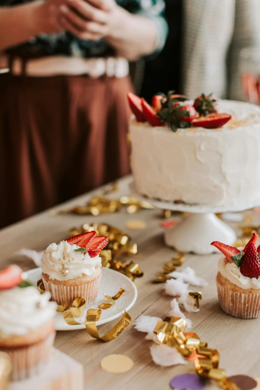 a table that has a cake and cupcakes on it, pexels contest winner, strawberry embellishment, white and gold color palette, clean image, 1x