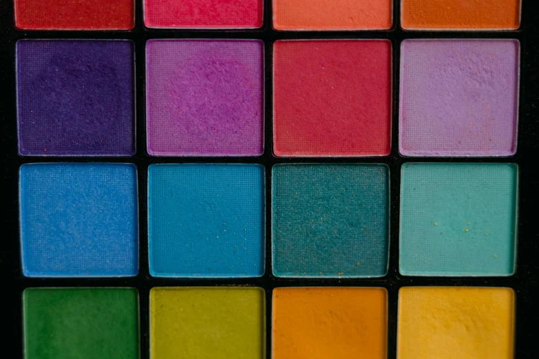 a close up of a palette of colored eyeshadow, a mosaic, inspired by Malevich, trending on pexels, color field, multicolor, multicolored