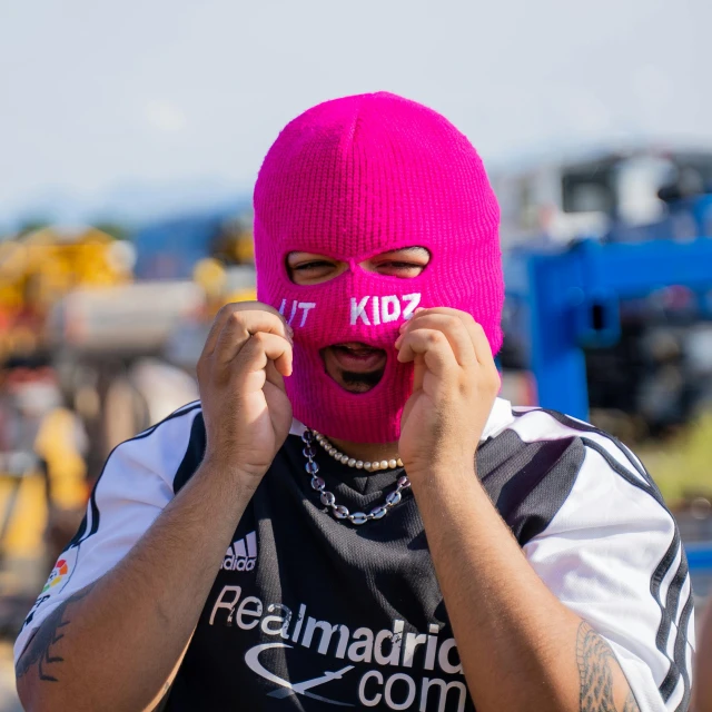 a man with a pink mask covering his face, inspired by Alonso Vázquez, reddit, football hooligans, y2k, profile image, demobaza