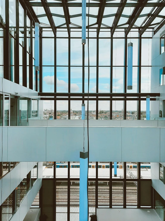 the inside of a building with lots of windows, inspired by Richard Wilson, unsplash, high-body detail, healthcare, painted metal and glass, hanging cables