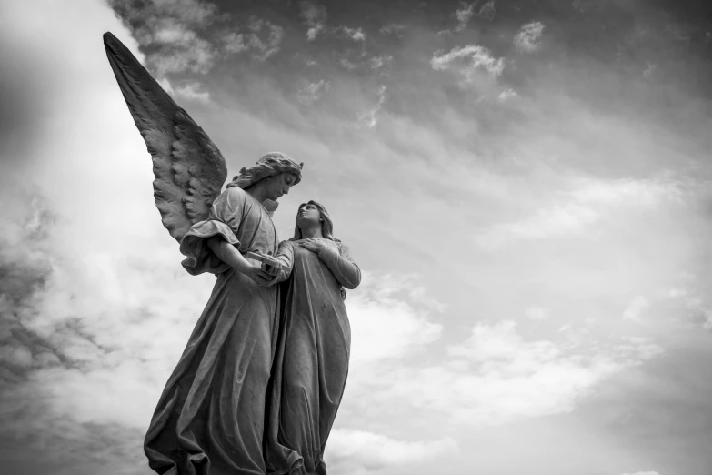 a black and white photo of a statue of an angel, by Joseph Werner, pexels, romanticism, 2 angels, looking at the sky, high quality upload, male and female