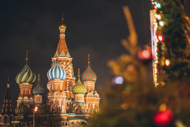 a christmas tree in front of a building, pexels contest winner, russian temple, profile image, colorful city, square