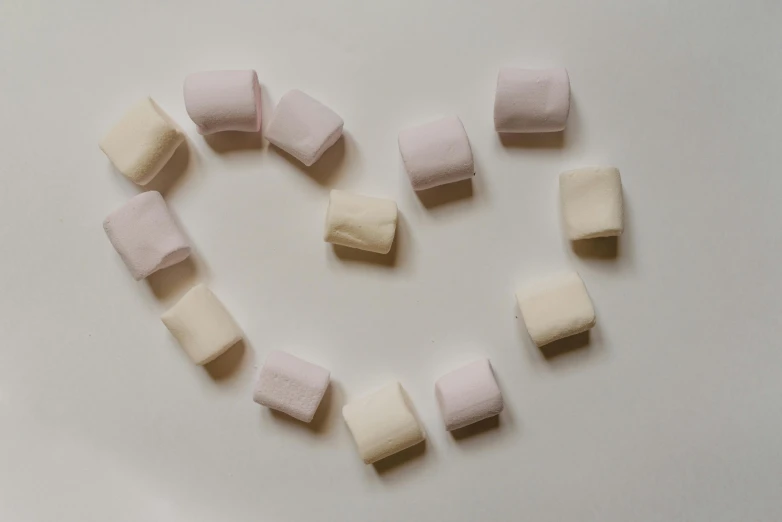 a heart made out of marshmallows on a white surface, inspired by Ödön Márffy, pexels contest winner, minimalism, square shapes, soft mist, 15081959 21121991 01012000 4k, made of candy