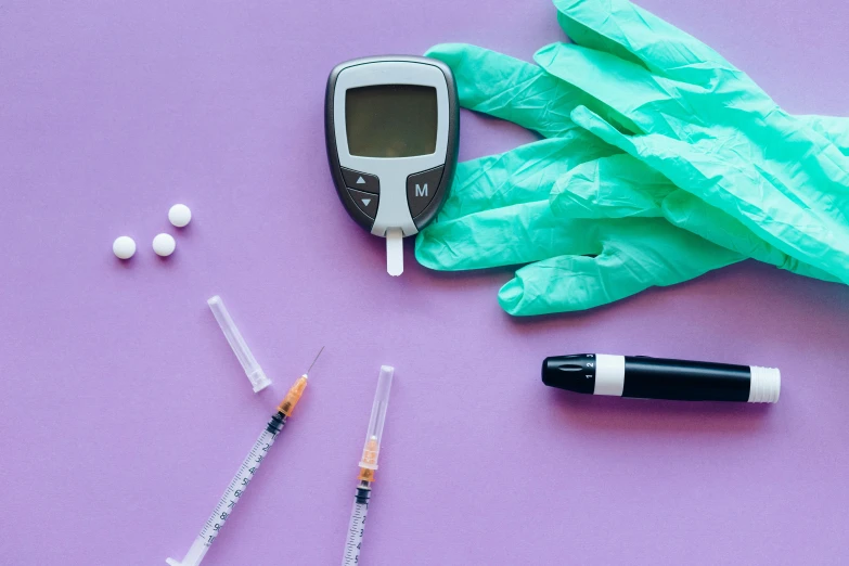 a close up of medical equipment on a purple surface, a picture, by Julia Pishtar, shutterstock, hurufiyya, cane, y 2 k aesthetic, drugs, brown and cyan color scheme