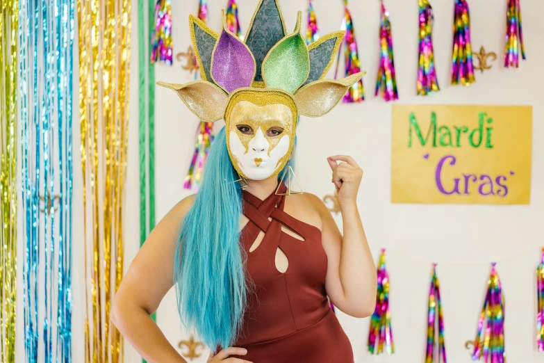 a woman with blue hair wearing a mardi gras mask, pexels contest winner, cardboard cutout, wearing golden cat armor, justina blakeney, ariel perez