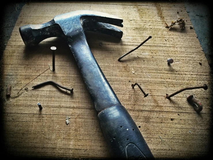 a hammer sitting on top of a piece of wood, unsplash, auto-destructive art, instagram photo, steel studs, a high angle shot, 15081959 21121991 01012000 4k