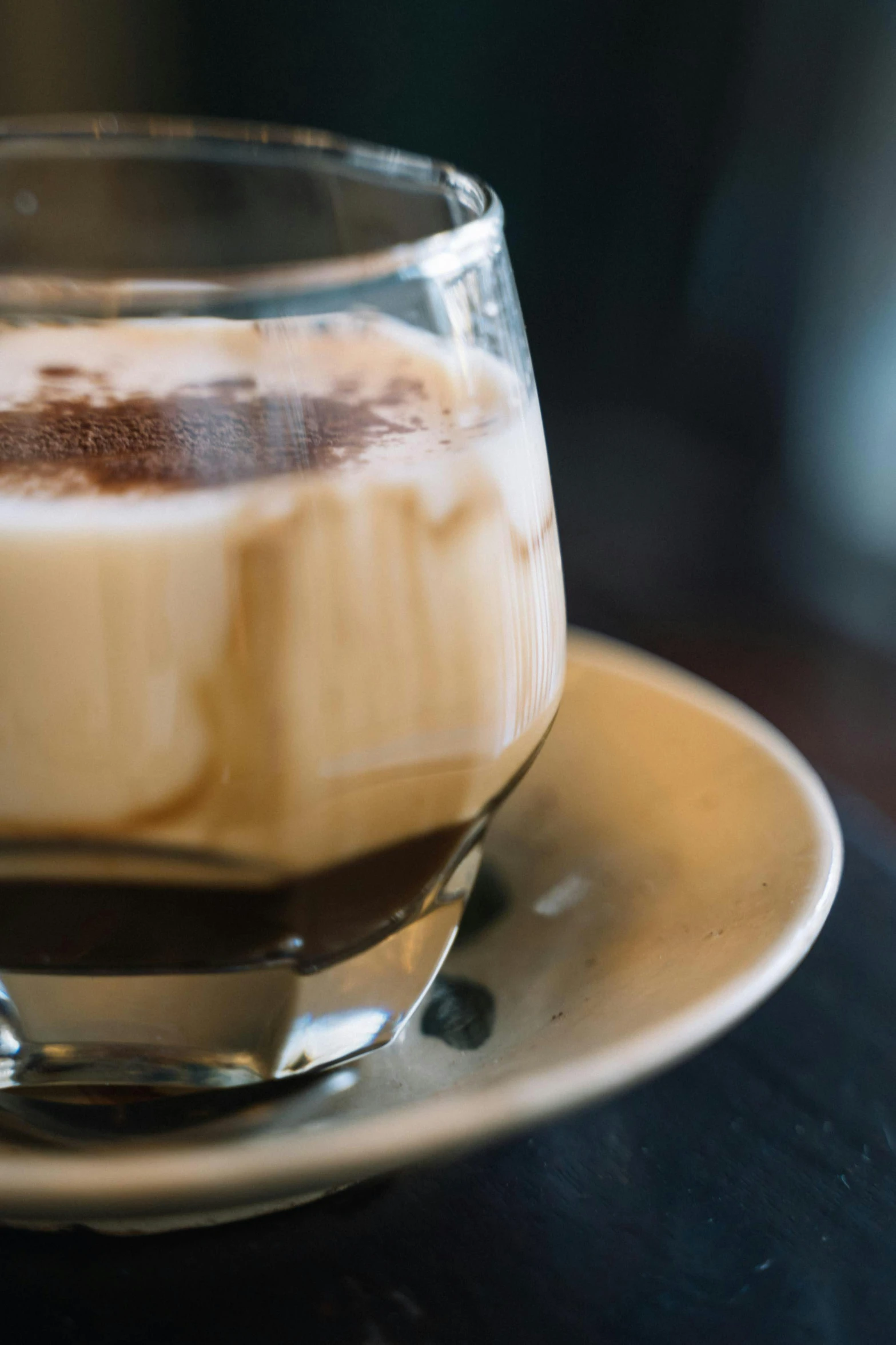 a close up of a cup of coffee on a saucer, rum, milk and mocha style, thumbnail, zoomed in