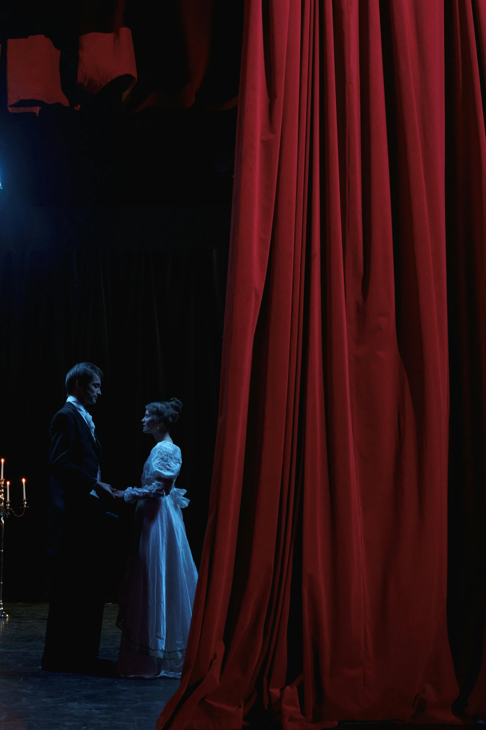 a couple of people standing on top of a stage, a portrait, inspired by Ivan Kramskoi, flickr, theater curtains are red, film still of emma watson, [ theatrical ], wedding