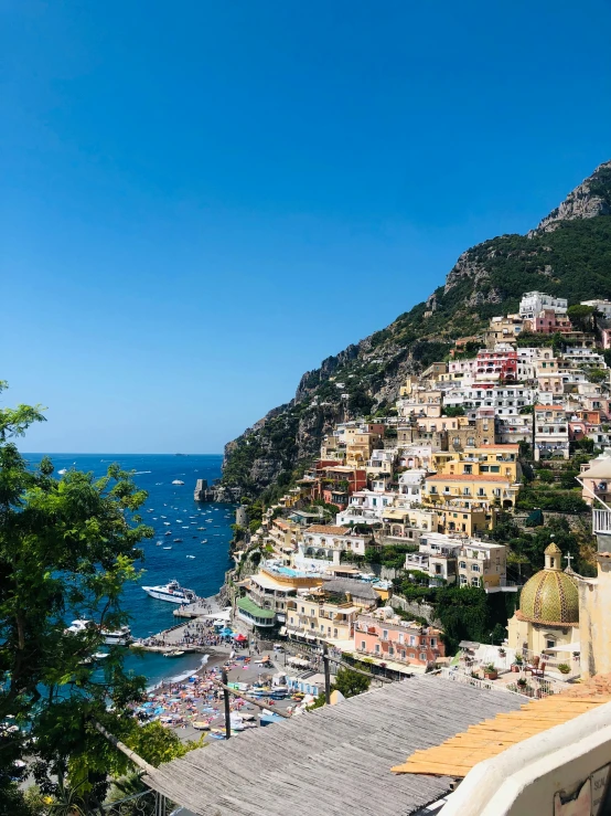 a view of a town from the top of a hill, by Julia Pishtar, pexels contest winner, renaissance, beautiful italian beach scene, 🎀 🗡 🍓 🧚, bright sunny day, staggered terraces