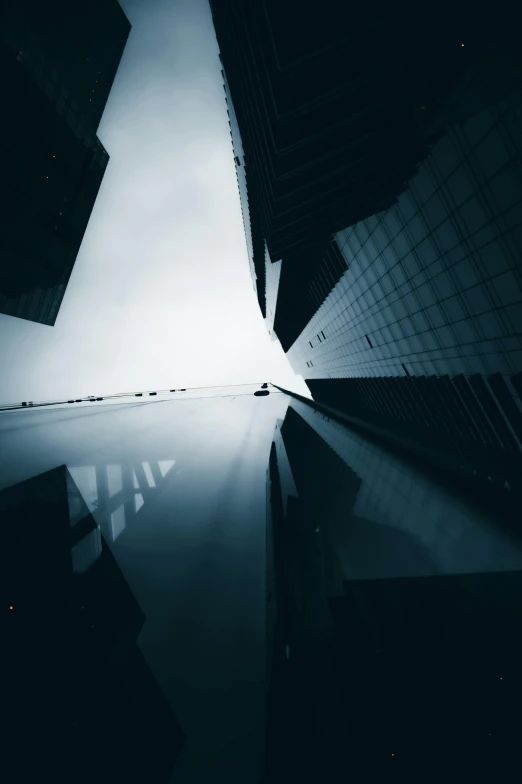 a black and white photo of a city at night, unsplash contest winner, hypermodernism, looking upwards, buildings made out of glass, traversing a shadowy city, photo of futuristic cityscape