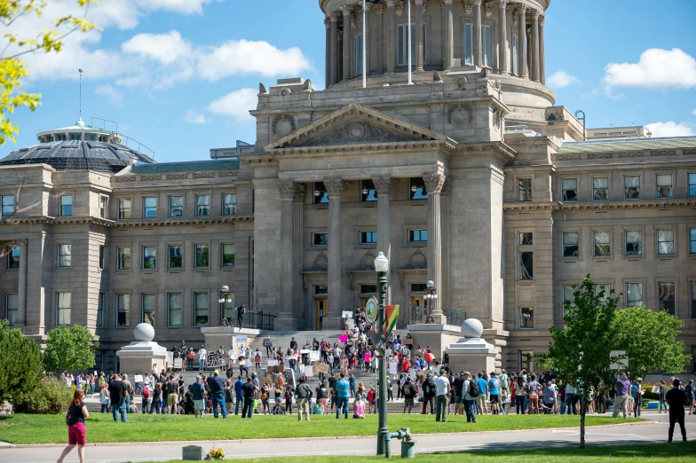 a large group of people standing in front of a building, capitol building, public art, hziulquoigmnzhah, square