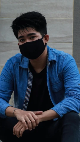 a man sitting on the steps wearing a face mask, pexels contest winner, realism, wearing a black shirt, ayan nag, profile image, wearing casual clothing