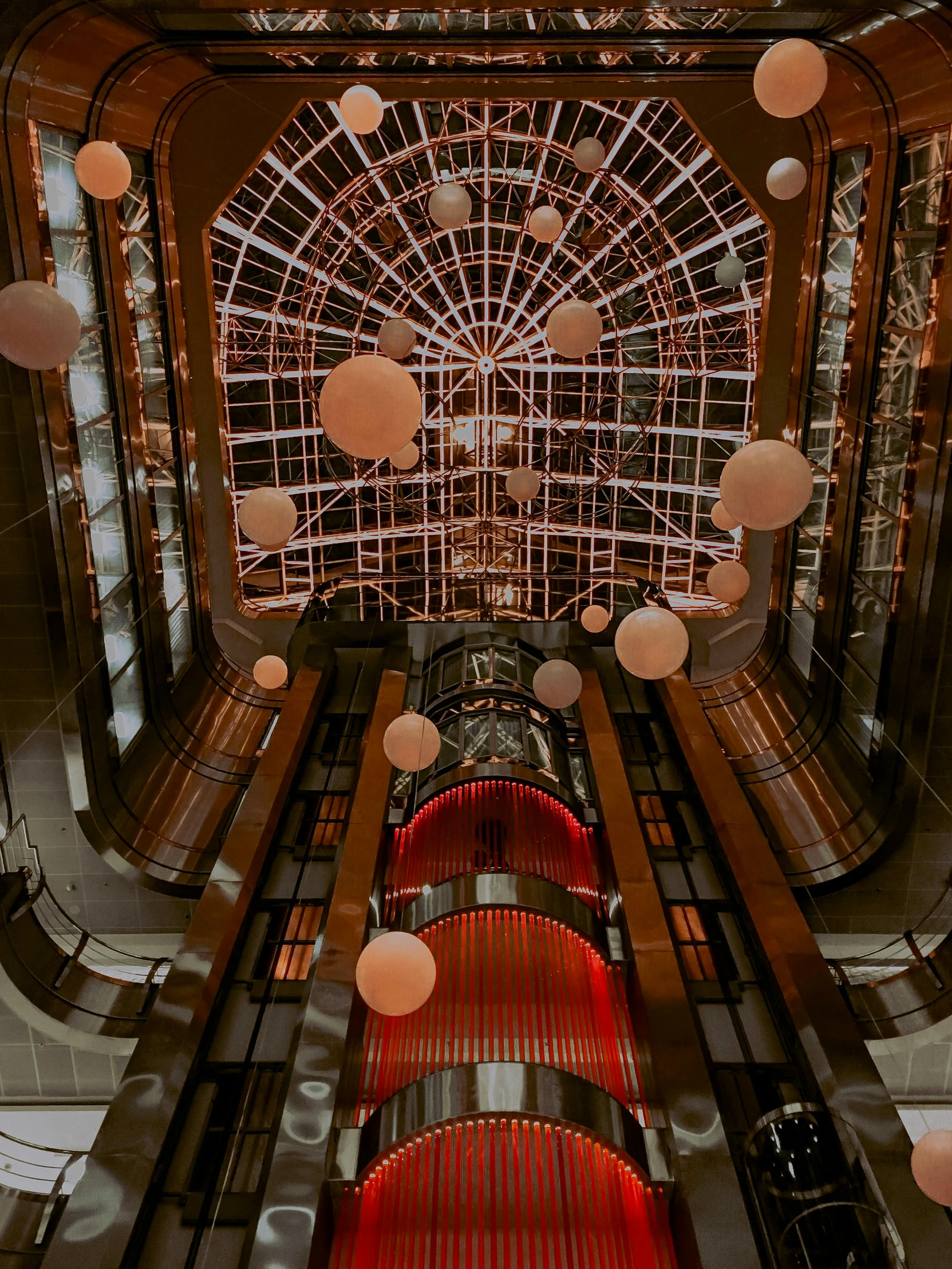 a view from the top of an escalator in a building, inspired by Sydney Prior Hall, unsplash contest winner, steampunk airships fly overhead, gif, hanging out with orbs, splash image